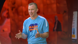 Host Jamie Watson presents in front of the giant inflatable liver at the MASH Across America launch event