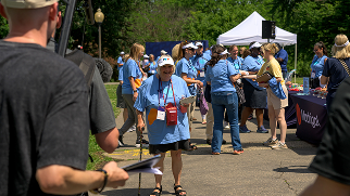 People standing near display tables
